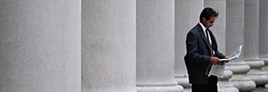 Photo of businessman in front of columns